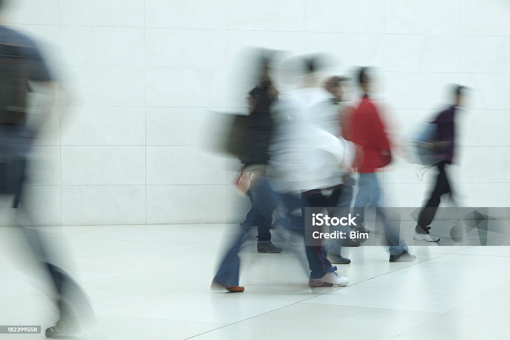 Commuters Walking in Corridor, Blurred Motion "people walking in a corridor, motion blurClick here to view more related images:" Blurred Motion Stock Photo