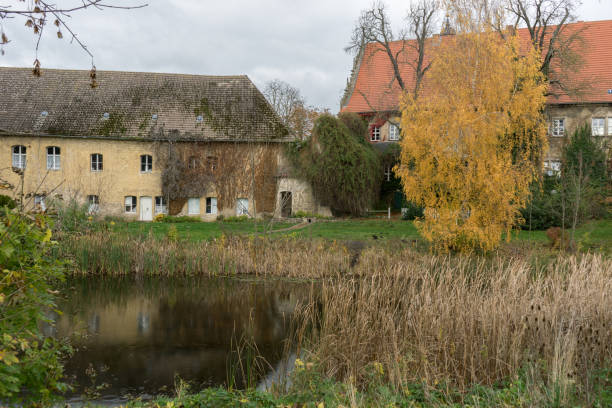 istock Old buildings by the pond 1824004207