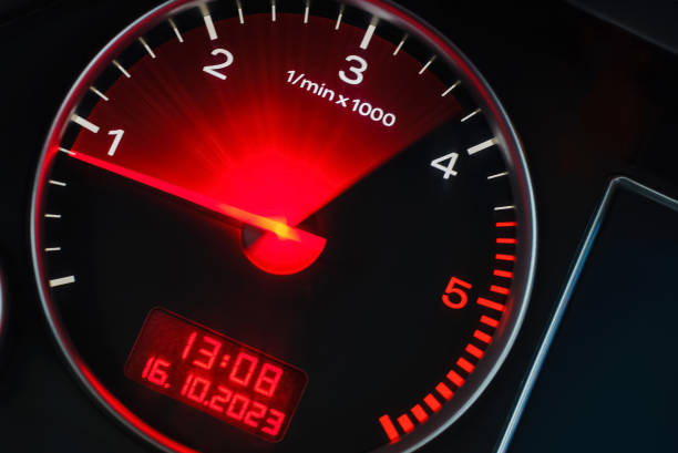 istock Motion blur of a car instrument panel dashboard odometer with red illuminated display.Car speedometer. High speed car speedometer and motion blur at night. 1824005247