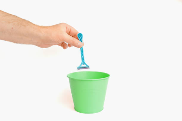 istock The disposable razor is thrown into the trash basket.White background,selective focus,copy space. 1824006330
