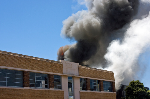 A large toxic fire begins to take hold of a downtown warehouse.