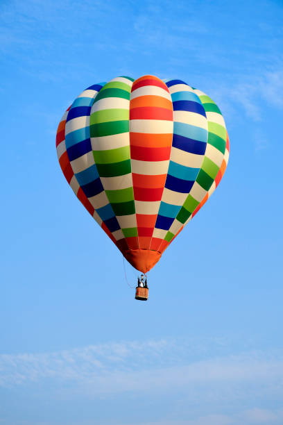 istock Colorful balloon over blue sky in the bright sun light. 1824006884