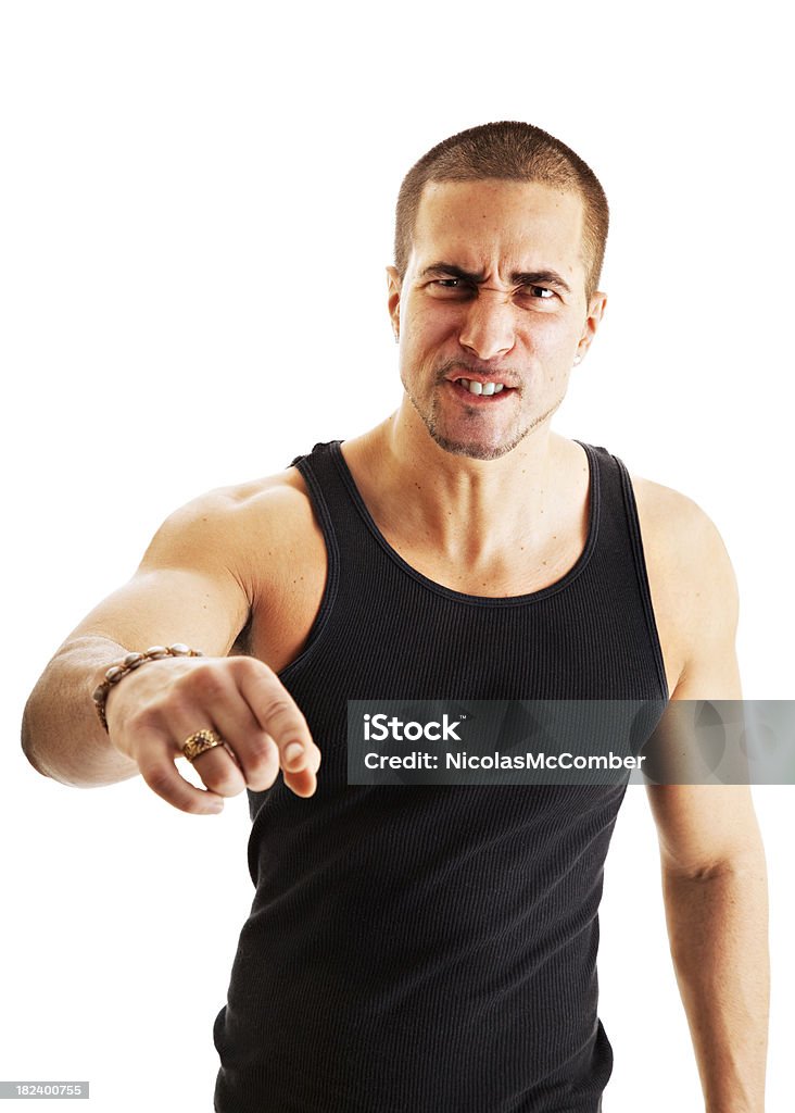 En colère jeune homme pointant de manière offensive - Photo de Fond blanc libre de droits