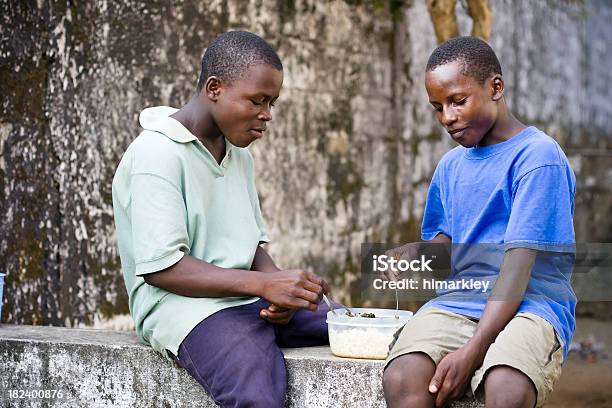 African Teens Eating Stock Photo - Download Image Now - Cousin, Africa, Eating