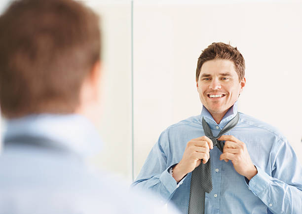 istock Handsome businessman adjusting necktie 182401133