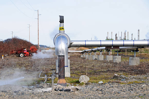 istock Steam valve in pressurized pipe at oil refinery 182401893