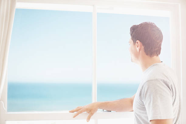 istock Mid adult man looking out 182402081