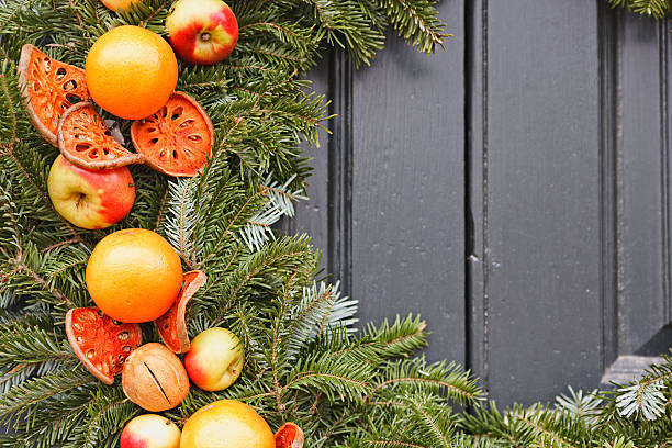 istock Natural Christmas wreath with apples and oranges 182402643