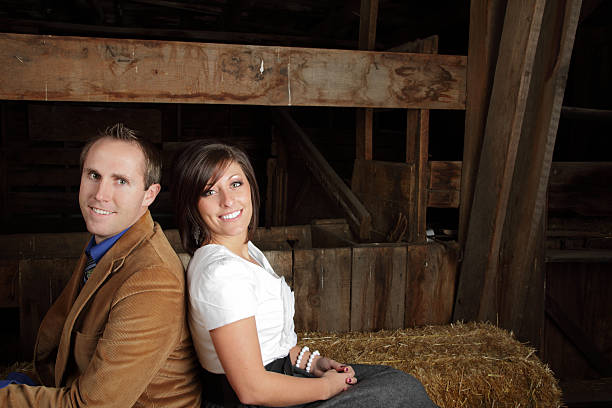 istock Young Couple Sitting In Old Barn 182403012