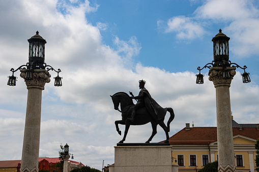 The statue of King Ferdinand under a cloudy sky in Oradea, Bihor County, Romania