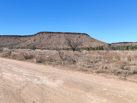 Dirt road to the rocky ridge line known as the Great wall of China due to its resemblance to the original on the Flinders Ranges, the largest mountain ranges in South Australia.