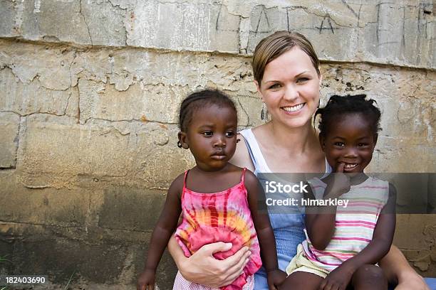 American Woman Holding African Girls Stock Photo - Download Image Now - Missionary, Africa, Charity and Relief Work