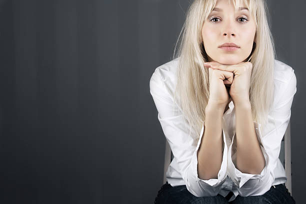 Blond girl staring stock photo