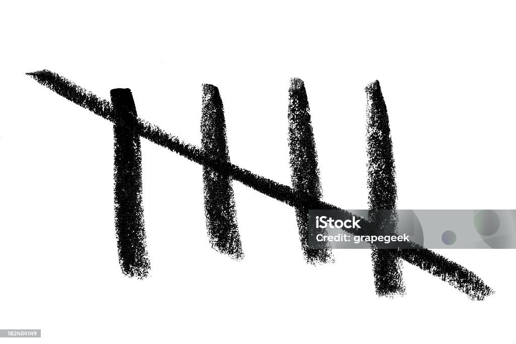 Tally Counting Tally count of five on a white background with black marks from crayon. Nice rough texture on paper. Tally Chart Stock Photo