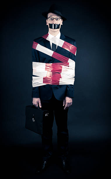 Businessman gagged "Businessman gagged with tape. Concept - Freedom of speech, Something to say, Silenced." mouth gagged stock pictures, royalty-free photos & images