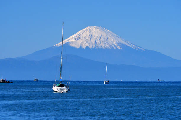 View of Snowcapped Mt. Fuji, taken at Moroiso Yacht Harbor in Miura City, Kanagawa Prefecture, Japan, which was taken in mid-November.\nMoroiso Bay is located at the tip of Miura Peninsula, south of Yokohama.\nMt. Fuji is designated as UNESCO World Heritage site.