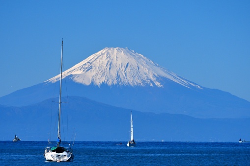 View of Snowcapped Mt. Fuji, taken at Moroiso Yacht Harbor in Miura City, Kanagawa Prefecture, Japan, which was taken in mid-November.\nMoroiso Bay is located at the tip of Miura Peninsula, south of Yokohama.\nMt. Fuji is designated as UNESCO World Heritage site.
