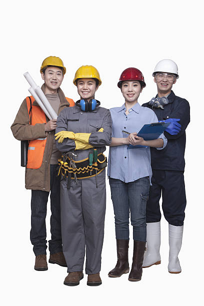 Group of construction workers standing against white background, smiling, portrait Group of construction workers standing against white background, smiling, portrait helmet hardhat protective glove safety stock pictures, royalty-free photos & images