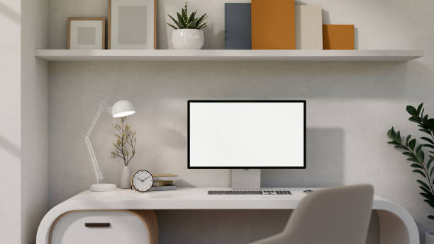 istock A white-screen PC computer mockup on a white desk in a modern trendy home office or private office. 1824065400