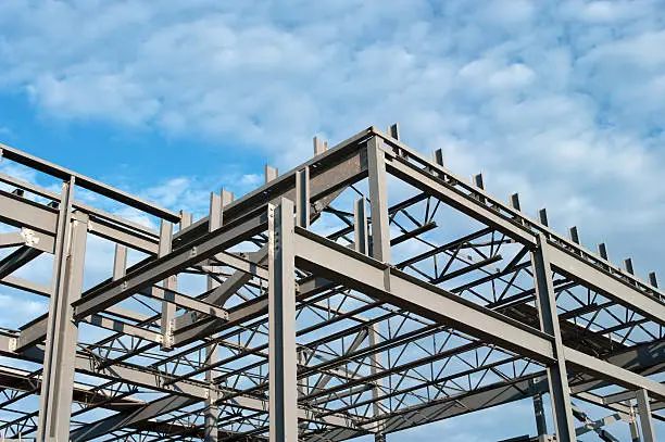 The steel frame of a new office building under construction.Similar Images.