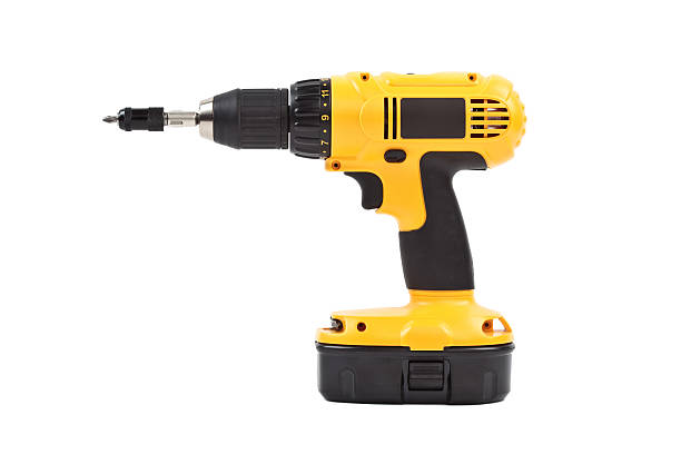 isolated power tool in yellow stock photo