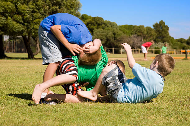 three wrestling boys - låtsasbråk bildbanksfoton och bilder