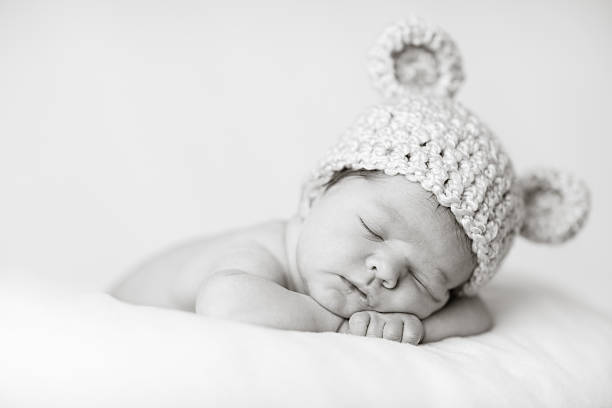 Sleeping Newborn Baby Wearing Knit Hat with Bear Ears