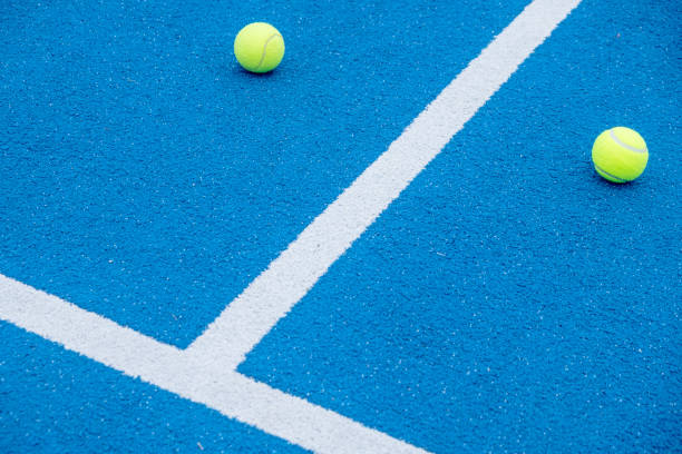 istock balls on a blue paddle tennis court with artificial grass 1824095760