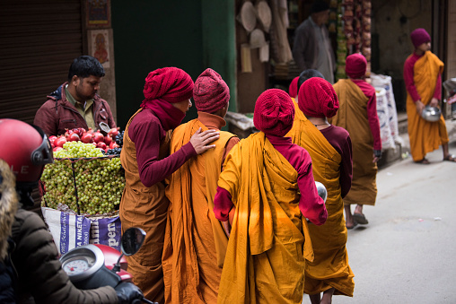 Kathmandu, Nepal- April 20,2019 : Buddhist monks walk the streets of Kathmandu, the capital of Nepal.