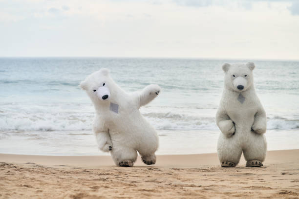 istock Animators dressed as polar bears entertain people on the beach 1824098561