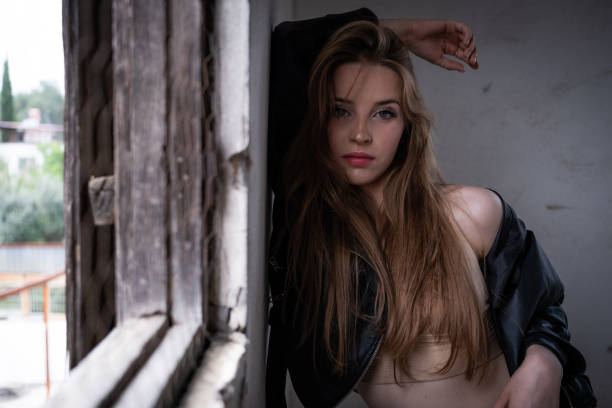 pretty smiling woman near window at home morning rest. High quality photo
