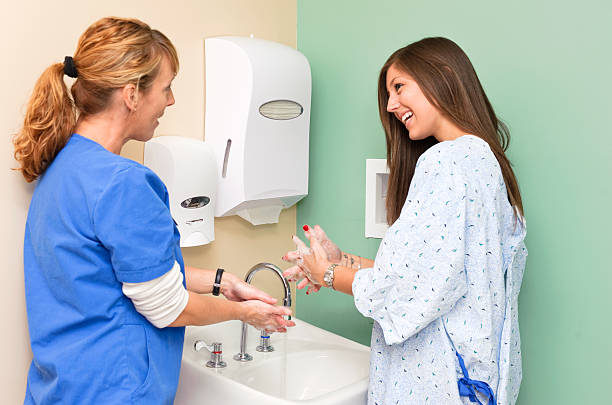 Infirmière et patient handwashing - Photo