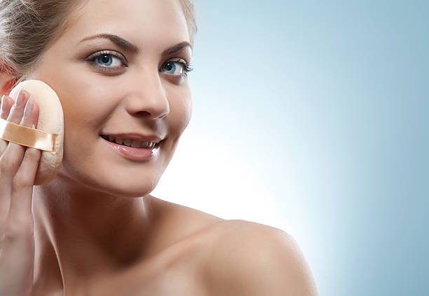 istock face of woman applying foundation 182410177
