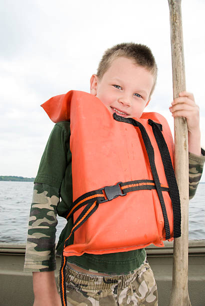 istock Young Boy in Life Jacket on Boat 182410245