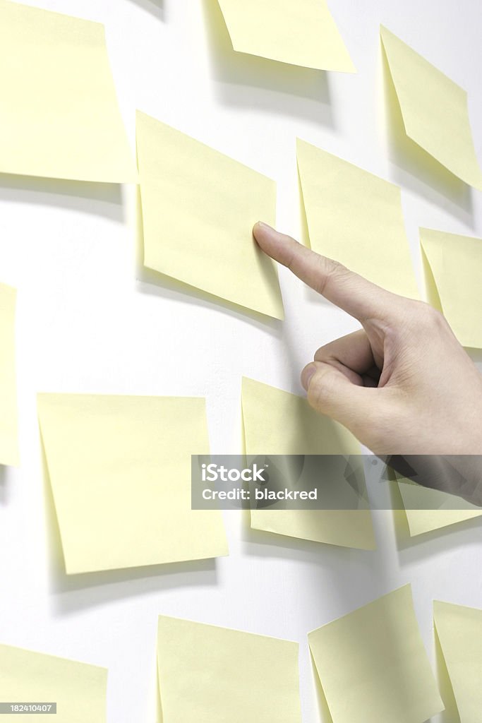 Important Message Hand pointing out one of many sticky notes.Similar images - Adhesive Note Stock Photo