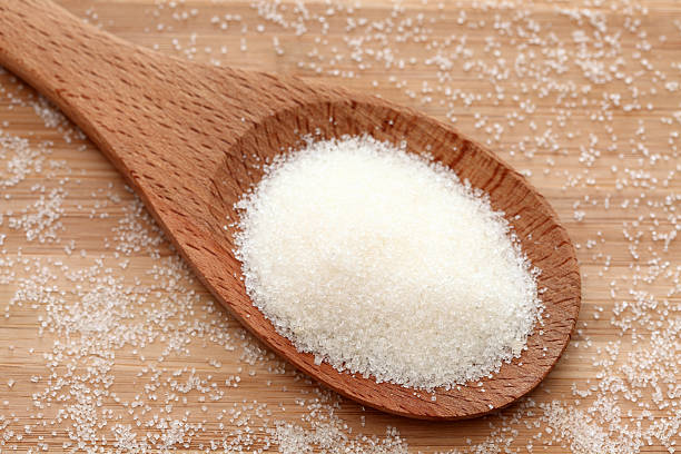 istock Sugar in a wooden spoon 182410672