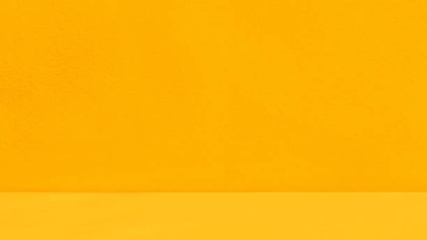 istock Empty yellow concrete wall with yellow wood floor room studio texture background. 1824120457