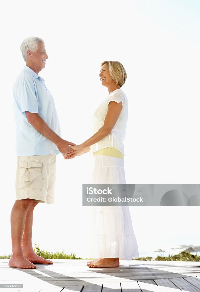 Side view of a romantic couple enjoying their vacation Side view of a romantic couple enjoying their vacation outdoors 50-54 Years Stock Photo