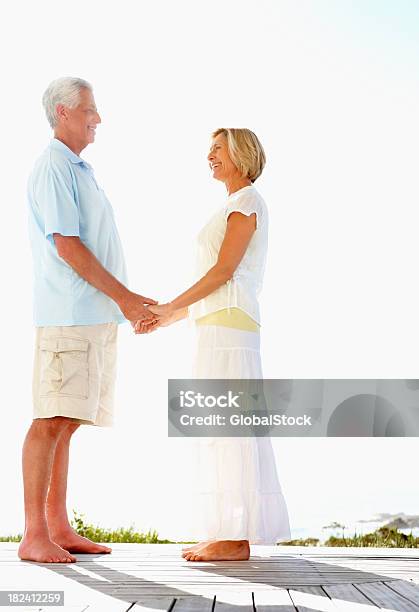 Side View Of A Romantic Couple Enjoying Their Vacation Stock Photo - Download Image Now