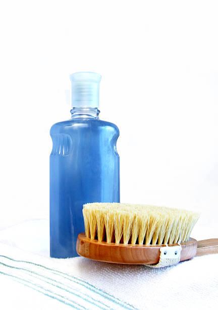 istock Bubble bath bottle, brush, towel. Isolated on white. Vertical. 182412550
