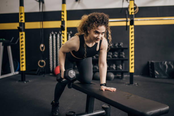 istock Woman exercising with dumbbell 1824127463
