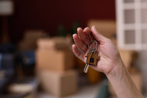 istock Woman getting new key from new flat 1824132285