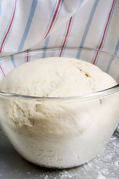 istock Freshly Risen Bread Dough In A Large Glass Bowl 182413445