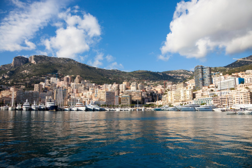 Monaco - April 19, 2022: Overview with the Monaco city and port during a spring sunny day with the F1 circuit construction under way.