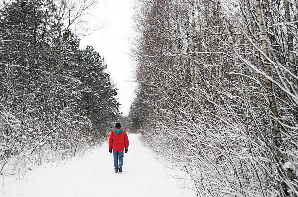istock Man in the winter forest 182413778