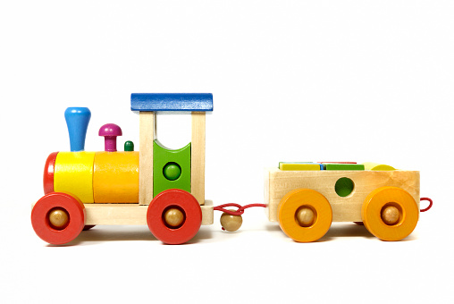 Multi-colored wooden toy train in front of a white background. Toy has no copyright protection!