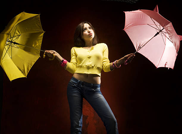istock Young woman and umbrellas 182414657