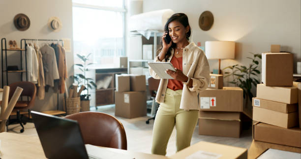 istock Business, phone call and woman with a tablet, boxes and connection with communication, ecommerce and website information. Consultant, employee or entrepreneur with technology, smartphone and internet 1824159291