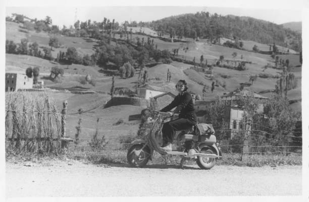 istock Young Woman on Vintage Motor Scooter. 1824163637