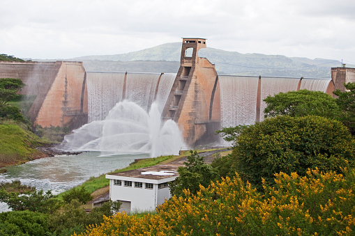 The Wagendrift Dam was constructed in 1963 on the Bushmans River in Kwazulu-Natal, South Africa, to supply approximately 3000 ha of irrigation between the dam and the Thukela River. The Dam Wall open and water seen spraying out.